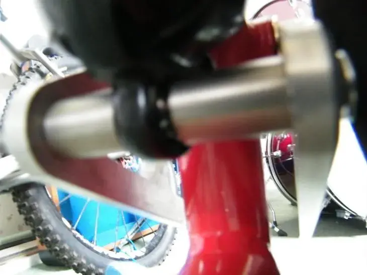 Stainless upper shock pivot bushes stepped down for M6 bolt.webp