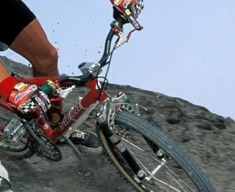 JMC shredding a berm close-up.webp