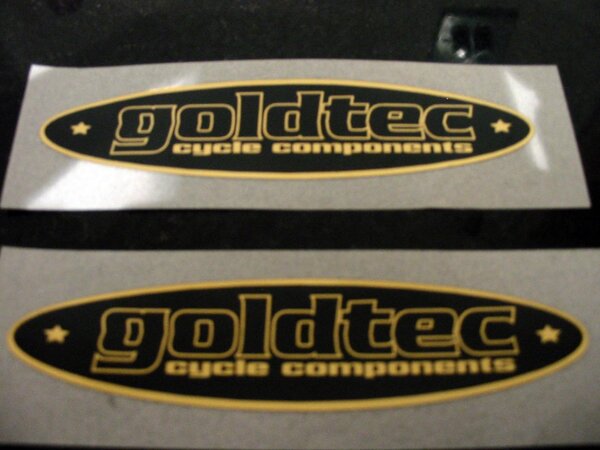 goldtec in gold + black 86mm X 20mm.jpg