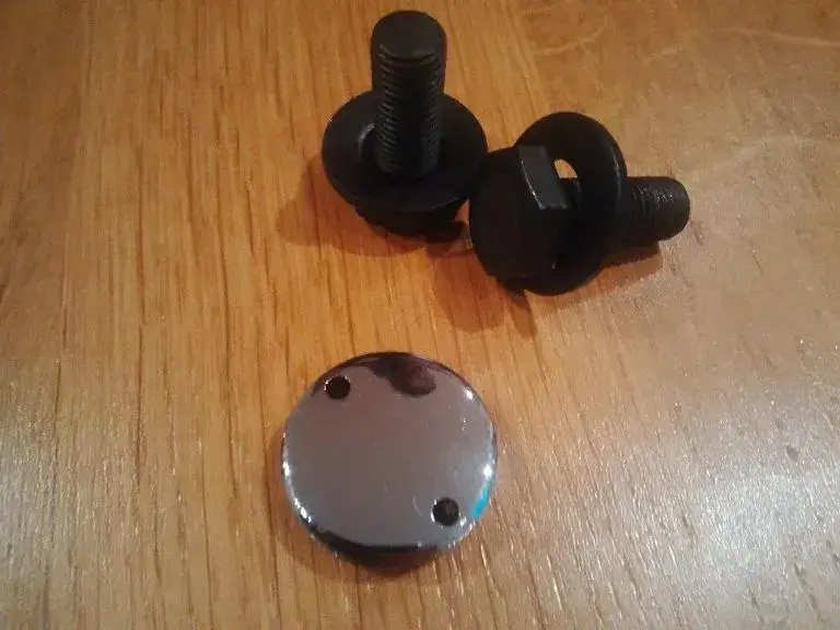 XT 730 bolts and dust cap.webp