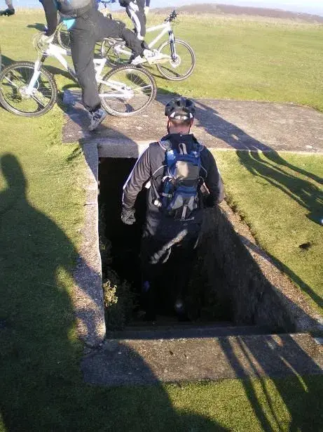 heathy inspects the bombshelter.webp