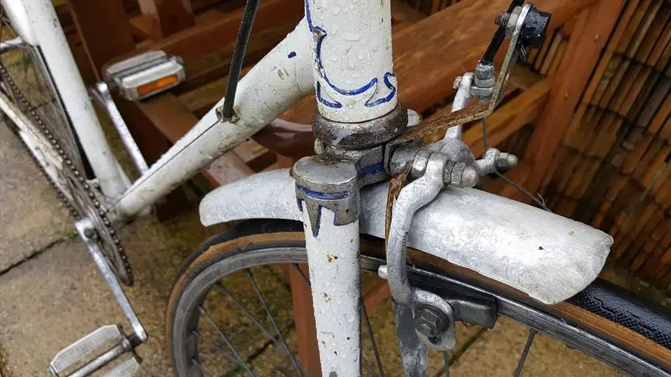 white racing bike forks.webp