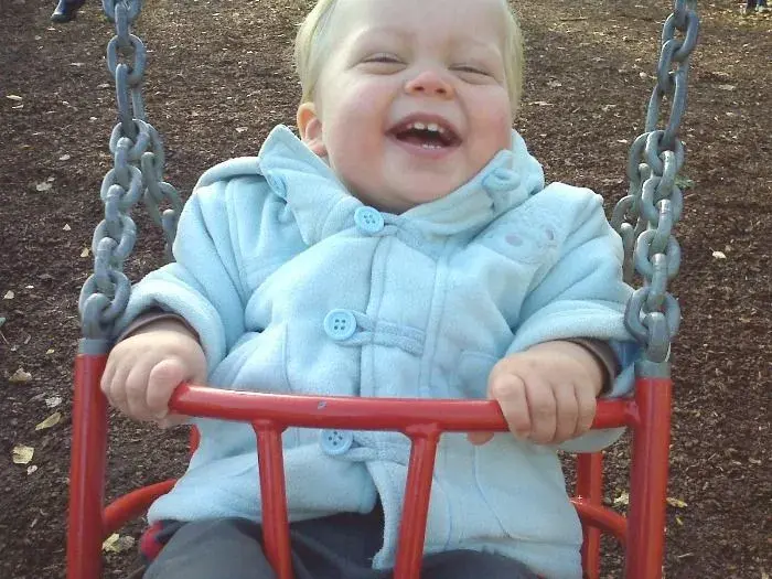 Titch on the swings.webp