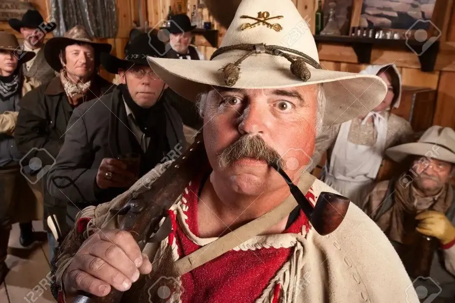 13889270-middle-aged-cowboys-in-an-old-western-saloon.webp