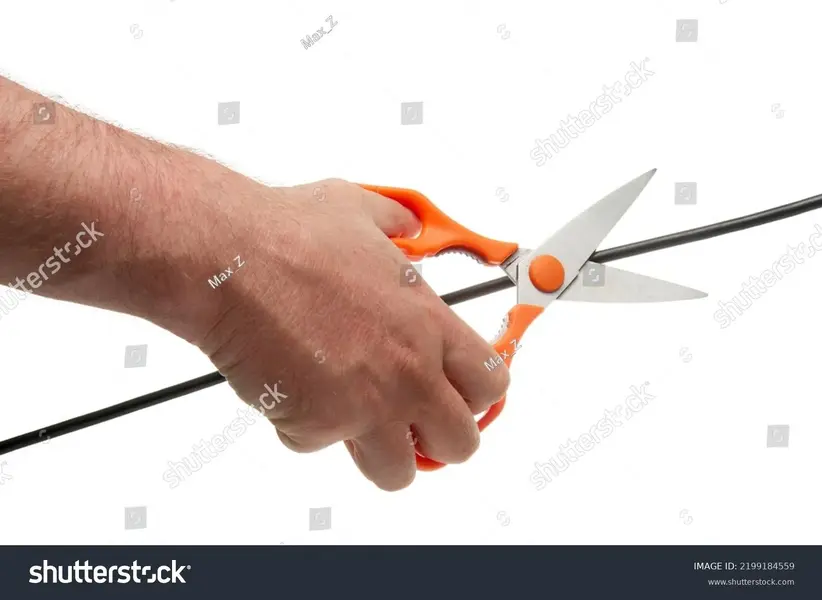 stock-photo-human-hand-with-scissors-cuts-a-black-wire-2199184559.webp