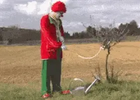 clown-watering-plant.webp