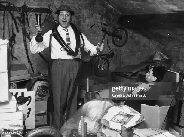 liverpudlian-comedian-ken-dodd-sorts-through-a-heap-of-junk-including-a-ventriloquists-dummy-...webp