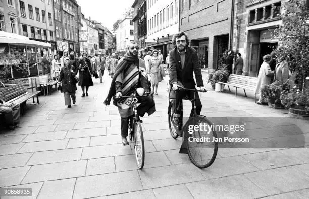 ringo-starr-riding-a-bicycle-down-a-pedestrianised-shopping-street-in-1977-in-copenhagen-denm...webp