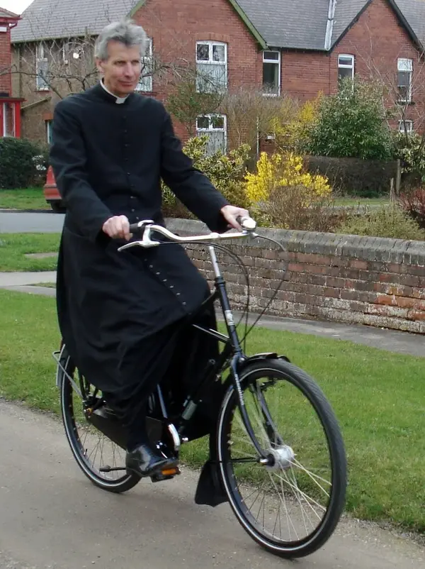 Priest riding %22priest bike%22  .webp