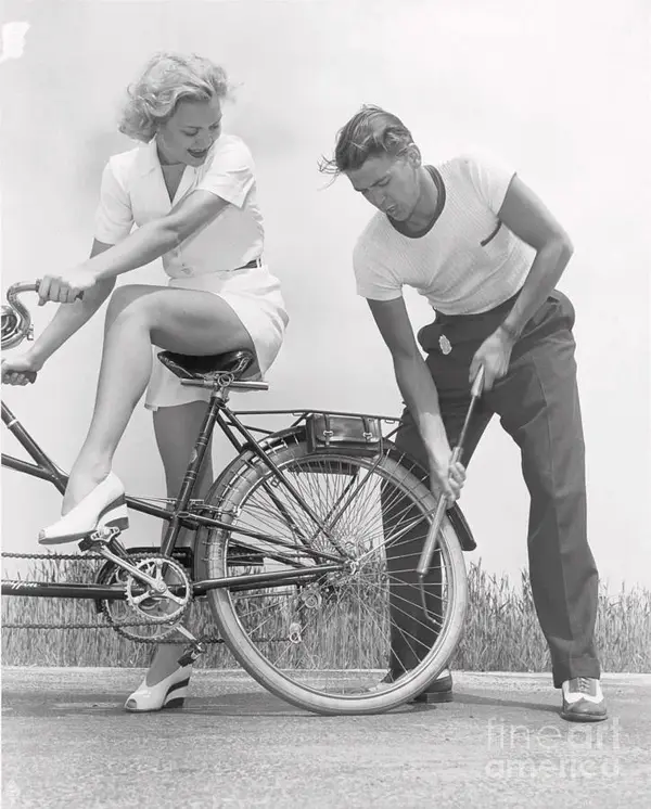 ronald-reagan-pumping-bicycle-tire-bettmann-2493239365.webp